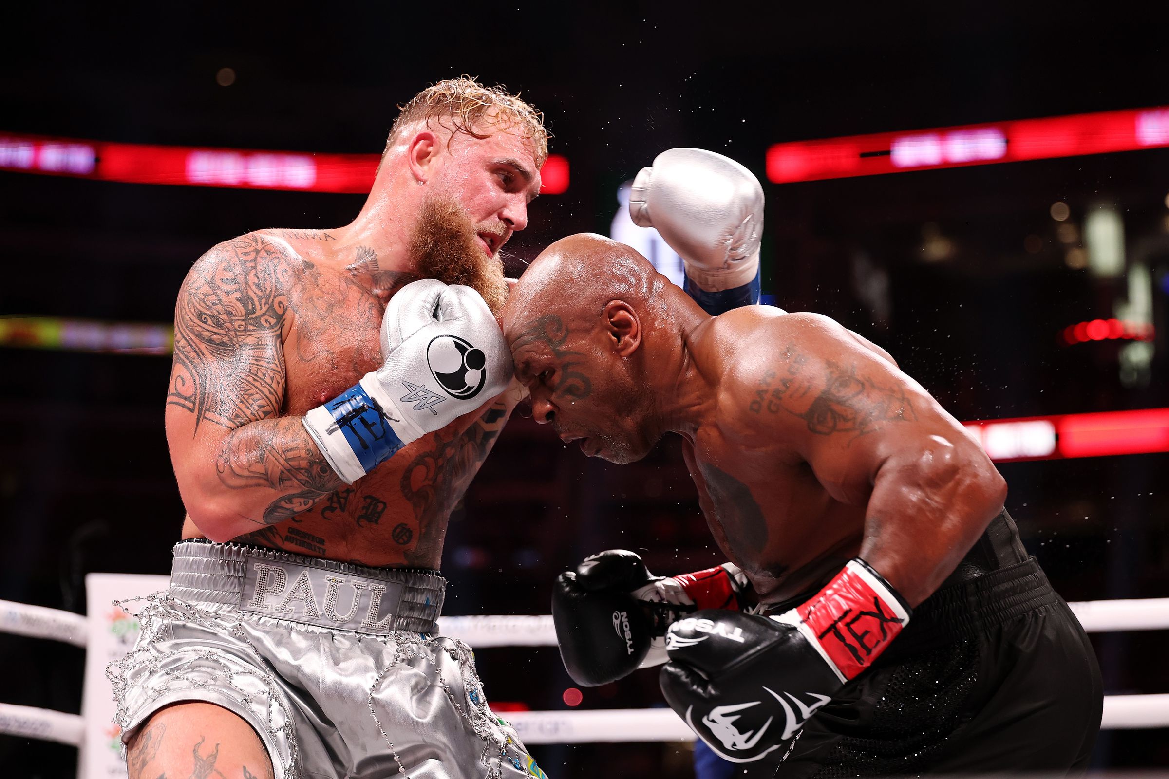 A photo showing Mike Tyson and Jake Paul in the boxing ring