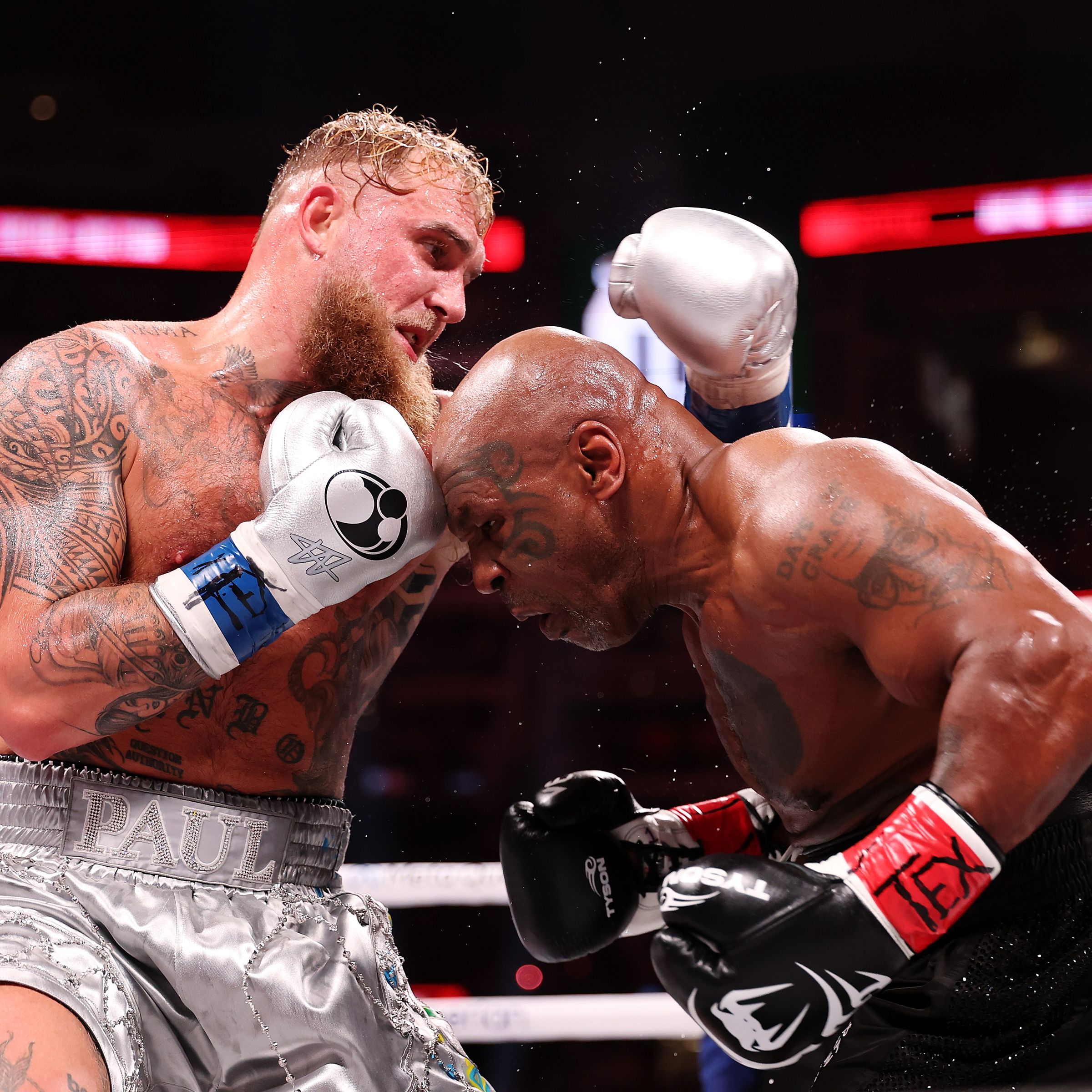 A photo showing Mike Tyson and Jake Paul in the boxing ring