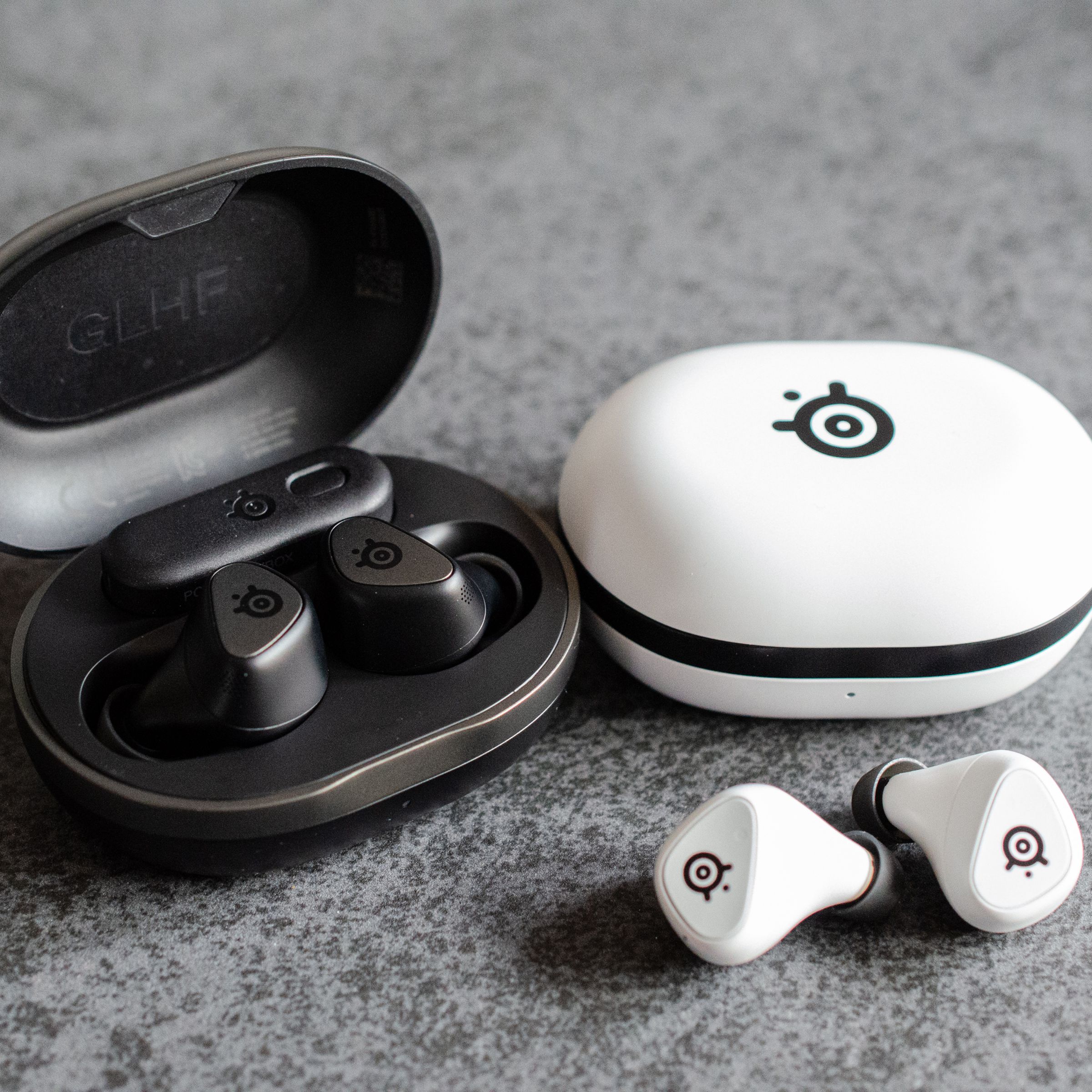 The SteelSeries Arctis GameBuds sitting on a desk