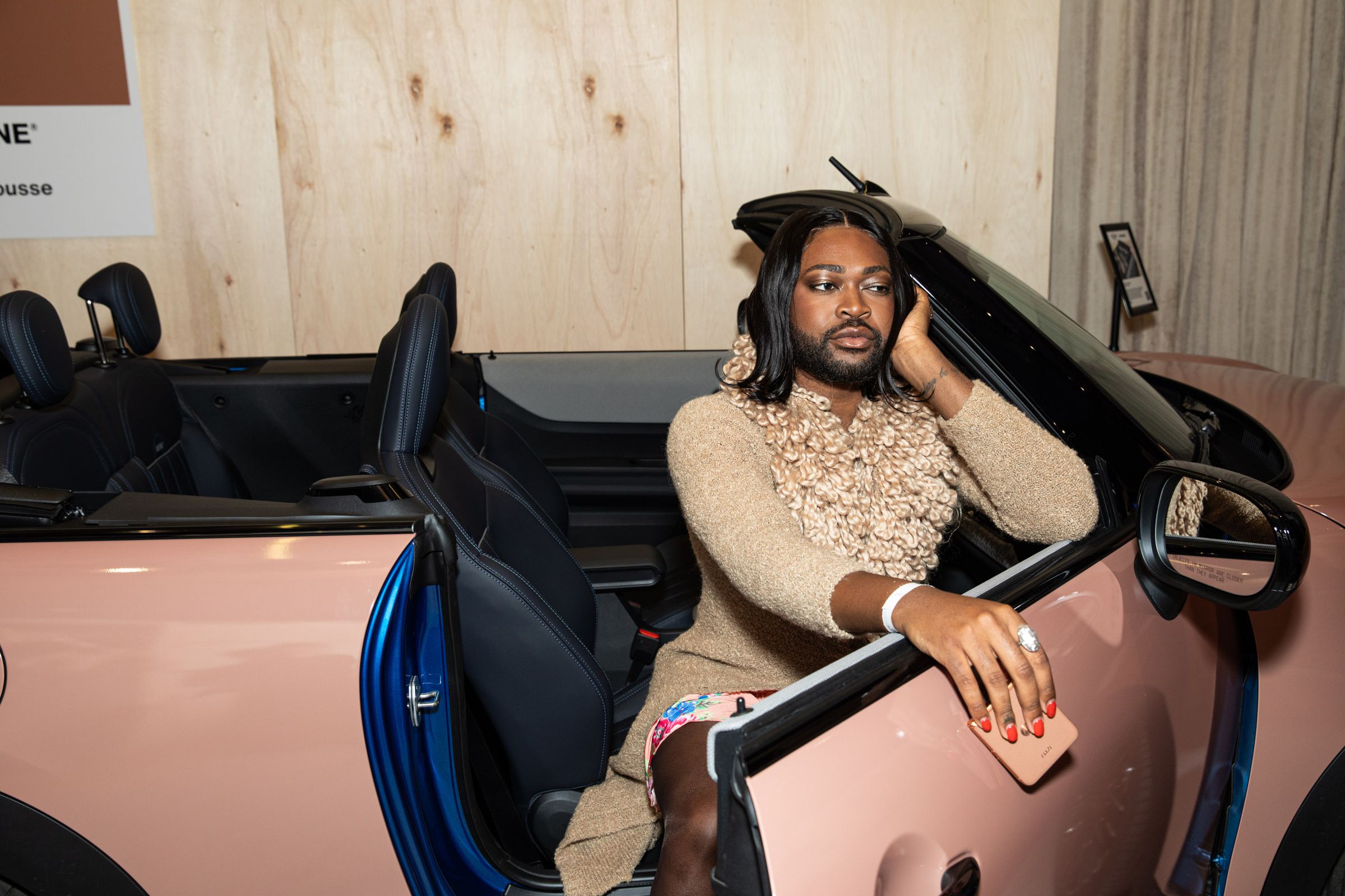 TikTok influencer Antoni Bumba poses in a Mini Cooper painted in Mocha Mousse, Pantone’s color of the year.