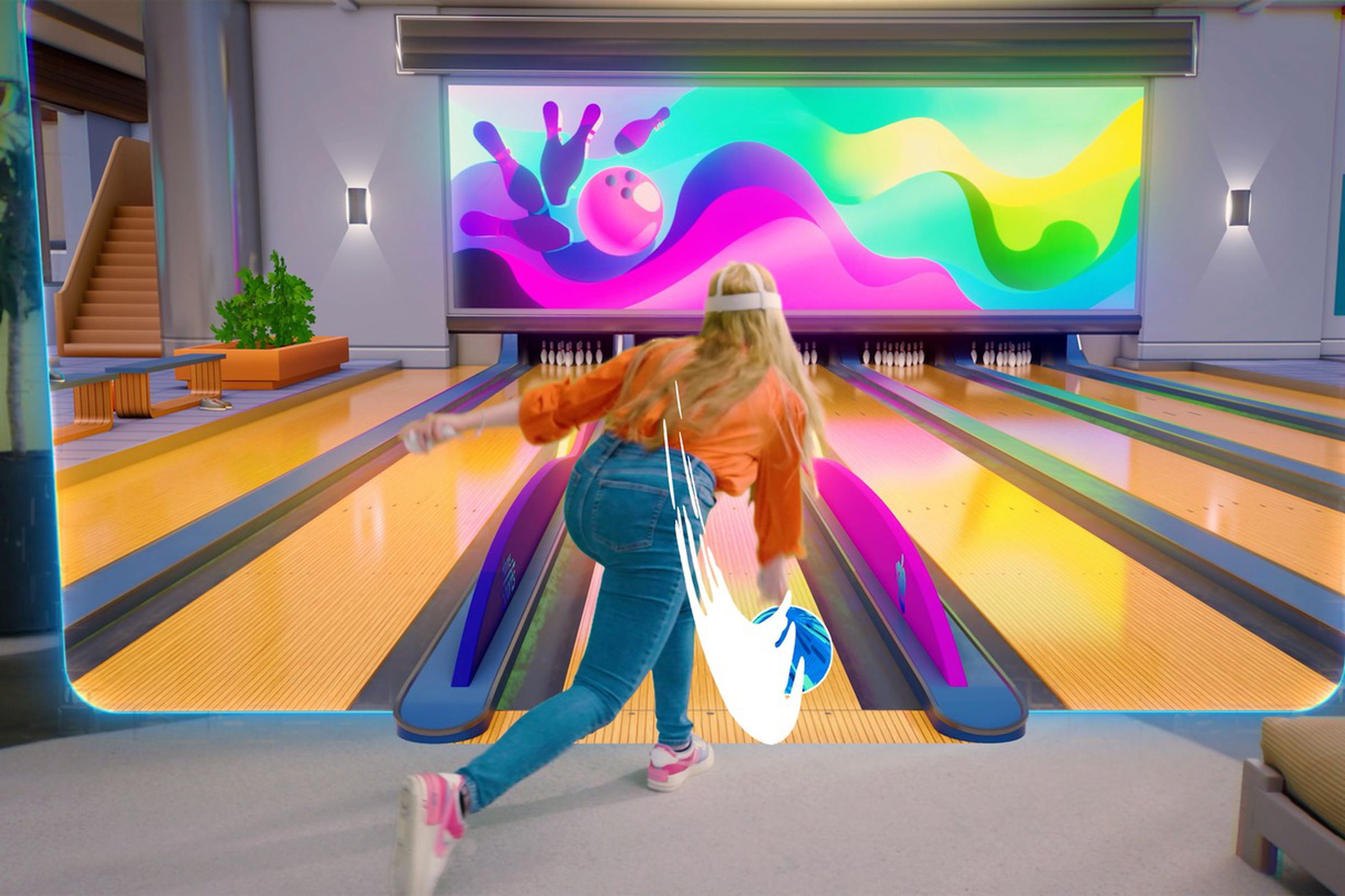 A picture of a person wearing an orange longsleeve shirt, jeans, and a Quest headset, swinging a virtual bowling ball toward a floating image of a bowling alley.
